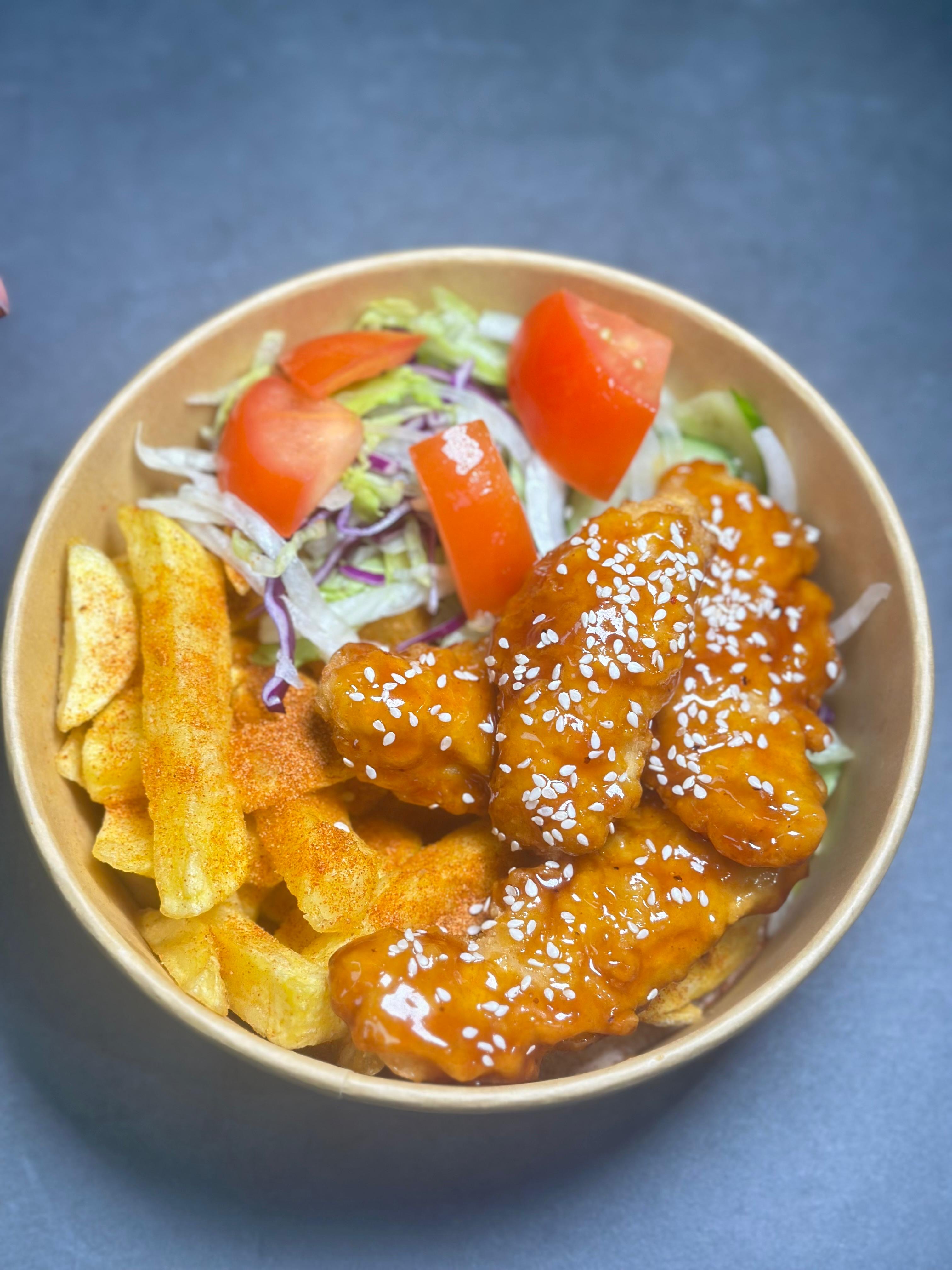 Coated chicken with chips and salad