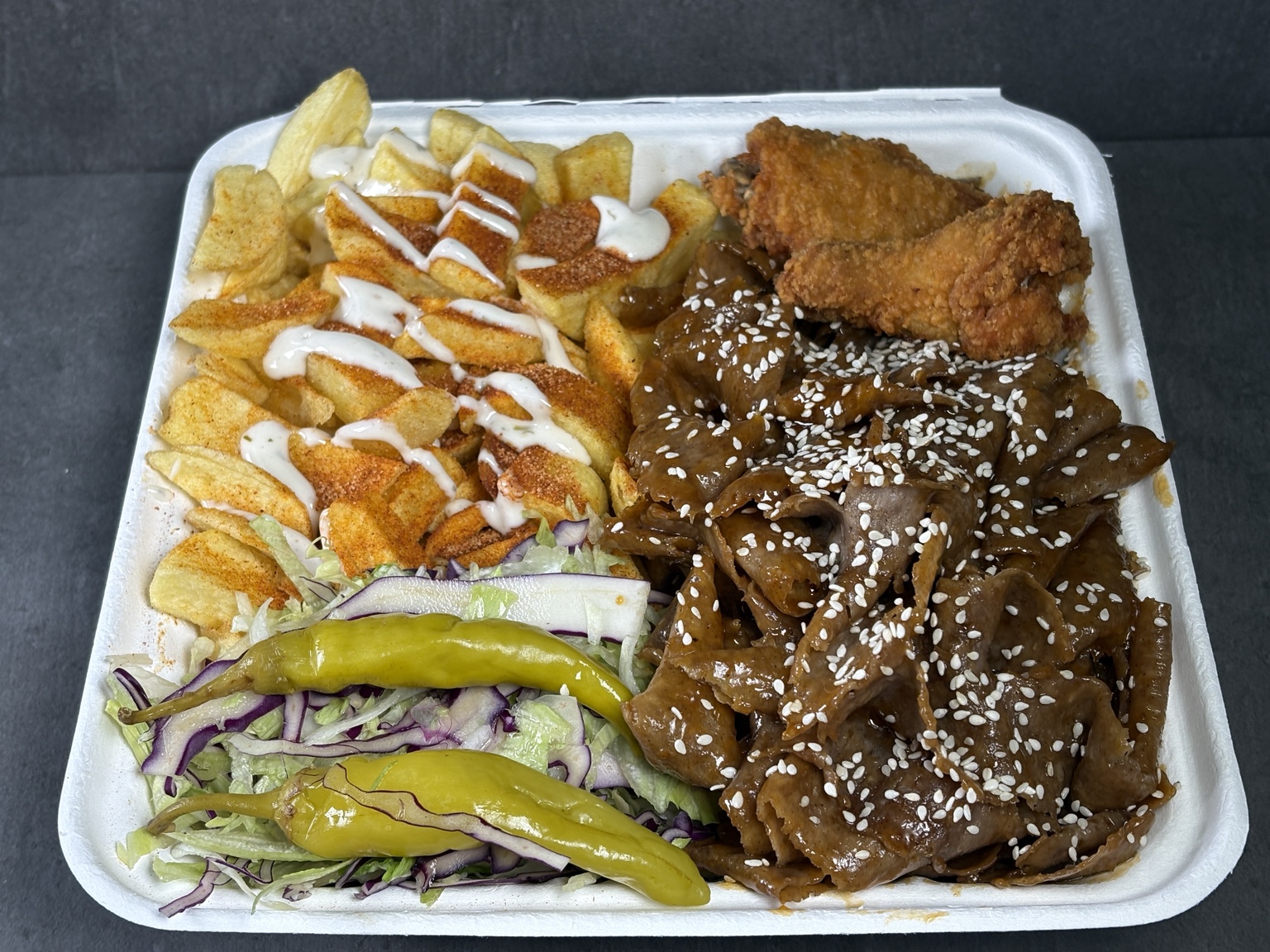 Lamb doner, chips and salad with sauces in a Trident meal box
