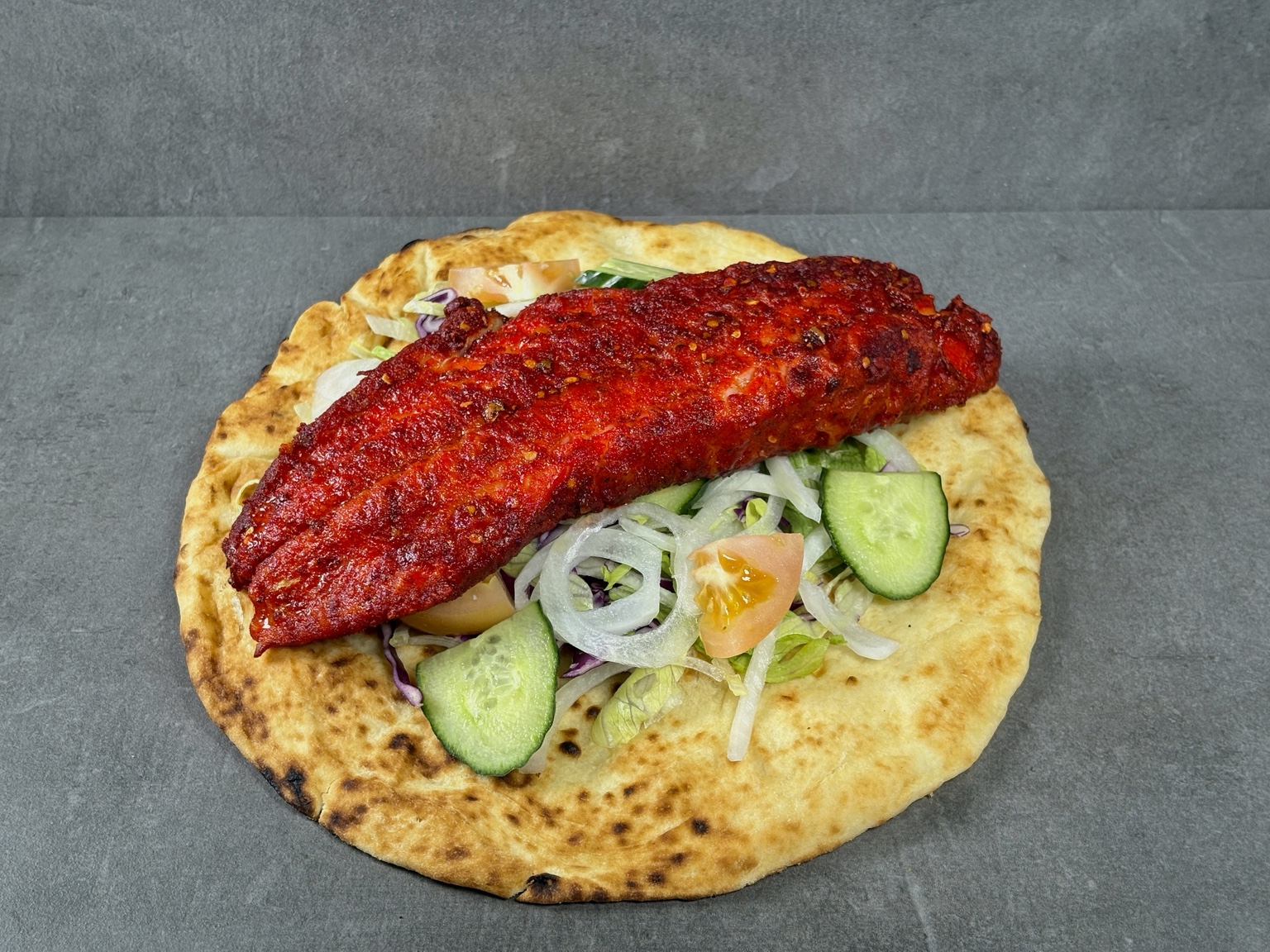 Trident masala cod on naan with salad